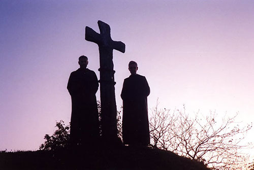 Two monks stone cross